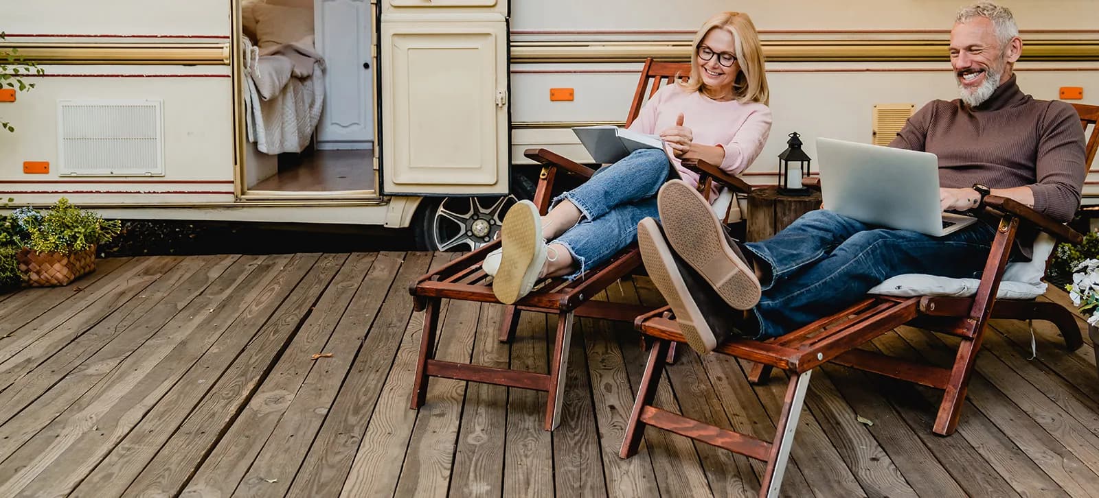 Couple sitting in front of RV