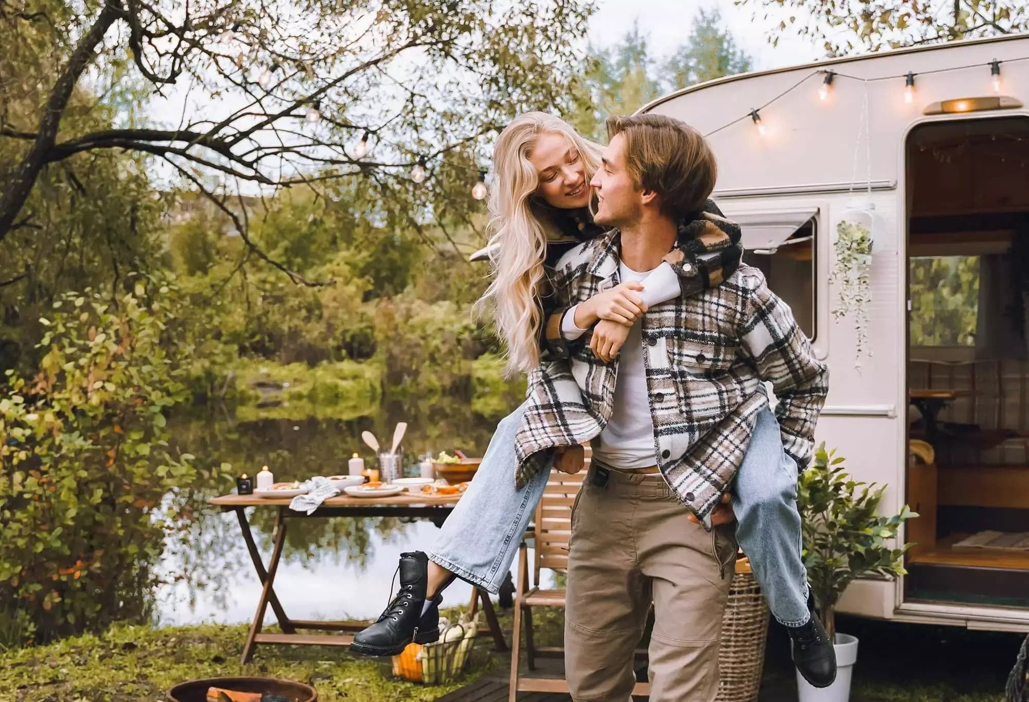 Couple in front of RV